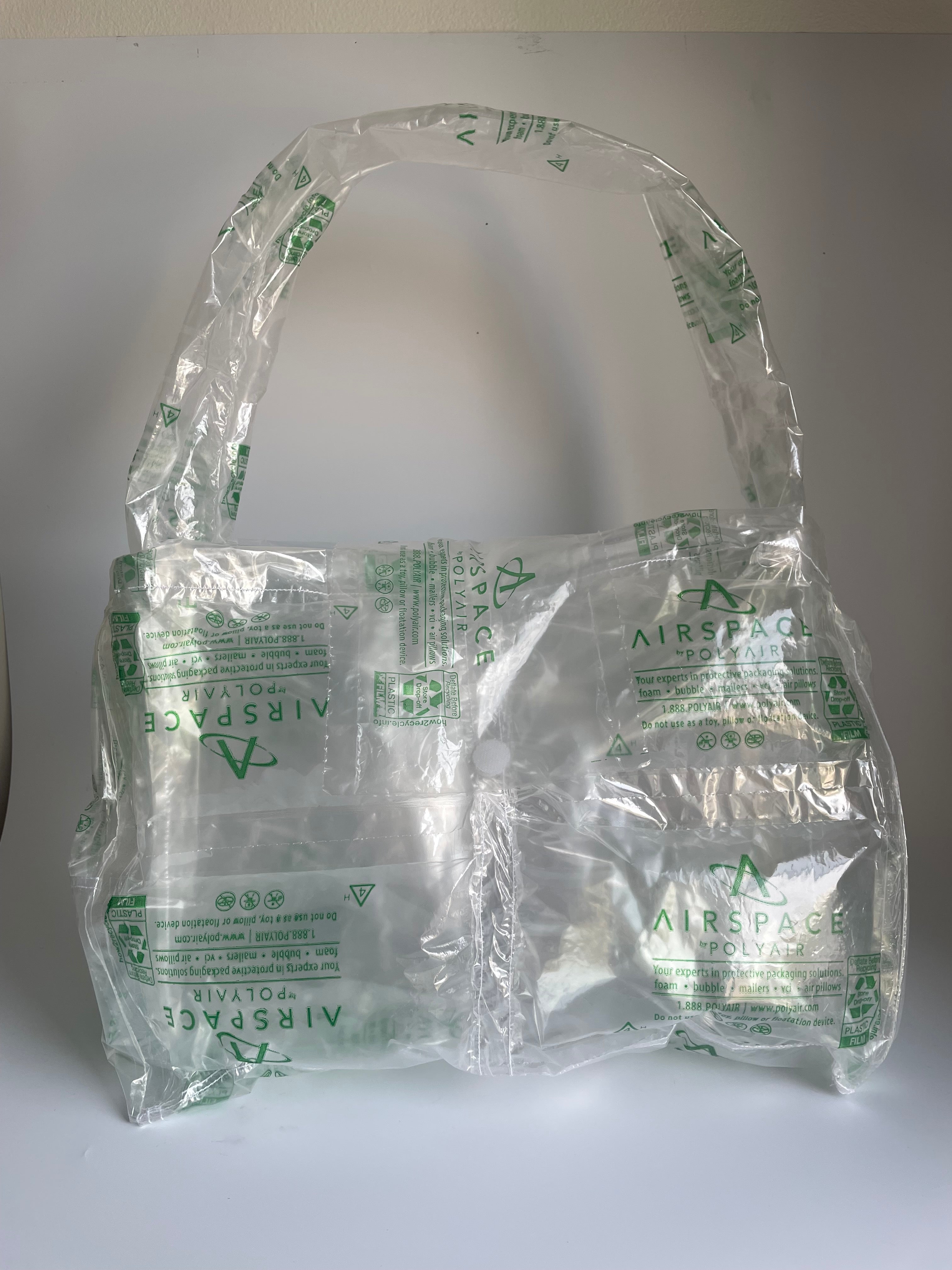 Shoulder bag made of recyclable packaging. Adaptable material reuse objects made to order in New York City by Sera ghadaki. 