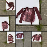 Reversible mini tie bag in oxblood leather and custom photo printed cotton/silk. Made to order in NYC.